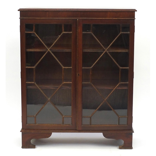 96 - Reproduction mahogany bookcase with astragal glazed doors, enclosing two shelves, 1120cm H x 88cm W ... 