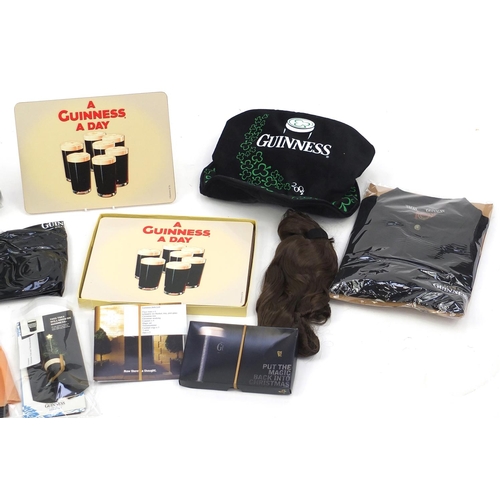 303 - Group of Guinness advertising items including hats and wigs