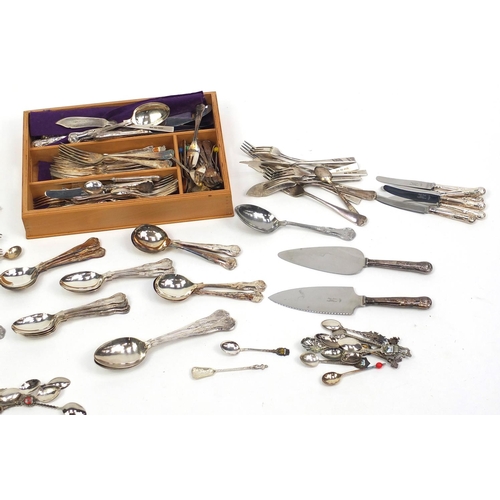 313 - Mostly silver plated cutlery including some with silver finials and ivorine handles