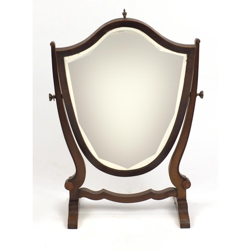 35 - Edwardian inlaid mahogany shield shaped swing mirror, with brass finial, 75cm high