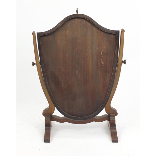 35 - Edwardian inlaid mahogany shield shaped swing mirror, with brass finial, 75cm high