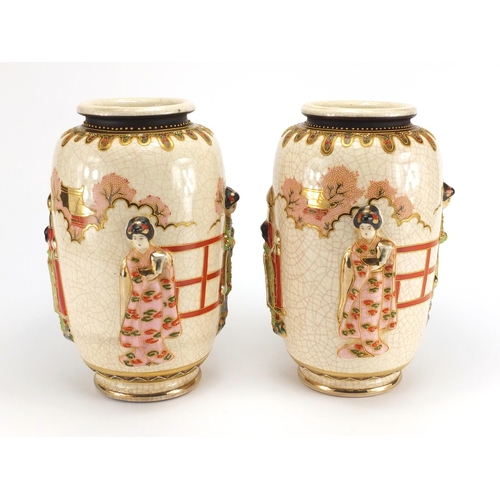 179 - Pair of Japanese Satsuma pottery vases, hand painted and decorated in relief with figures, character... 