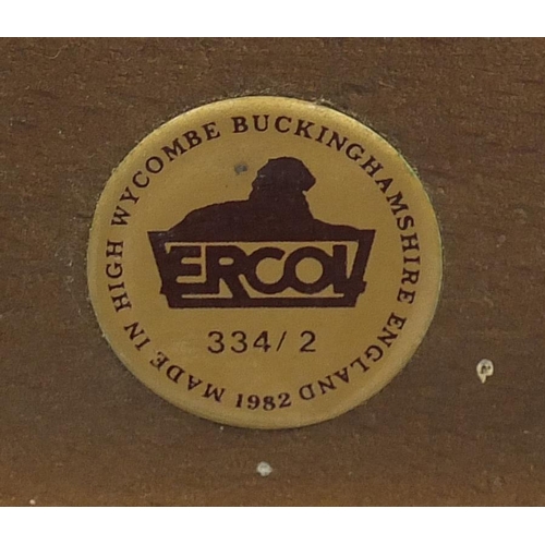 44 - Ercol dark elm three piece suite, the settee 130cm in length