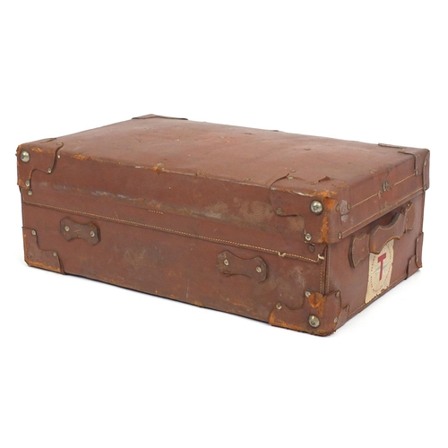 95 - Vintage bound leather suitcase with Peninsular and The Oriental Navigation Company labels, 66cm wide