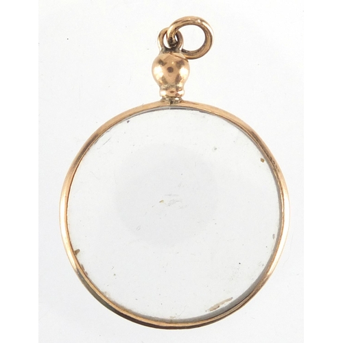 340 - 9ct gold circular mourning locket, 2.5cm in diameter, approximate weight 2.5g