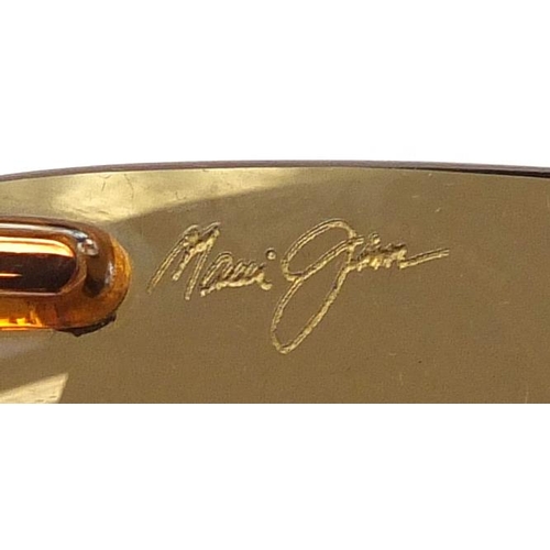 561A - Pair of Maui Jim sunglasses, with case