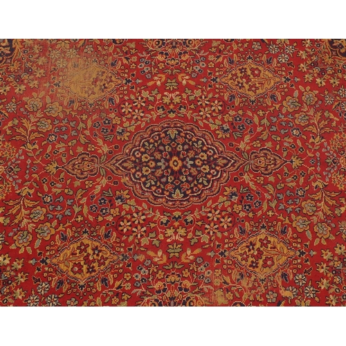 108 - Rectangular persian rug, the central field and corresponding borders having all over floral motifs p... 