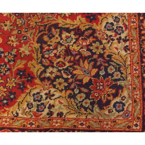 108 - Rectangular persian rug, the central field and corresponding borders having all over floral motifs p... 