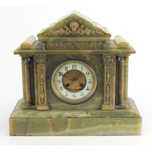 276 - Green onyx striking mantel clock with brass mounts, 35cm high