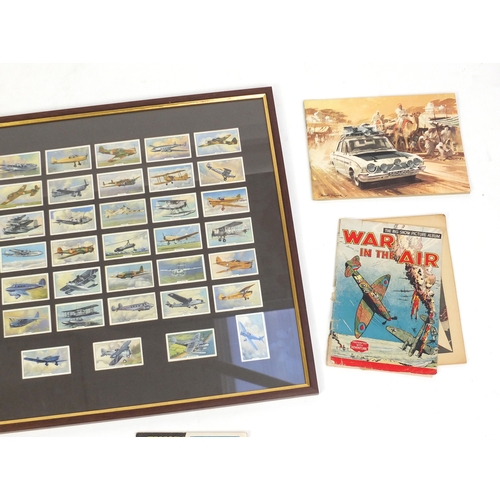 736 - Assorted cigarette cards including a glazed display of Military aeroplanes