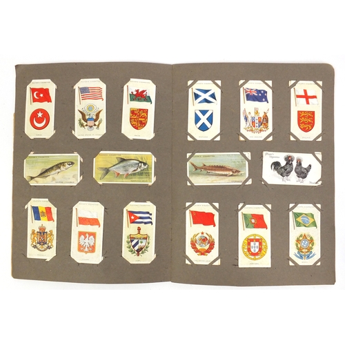 736 - Assorted cigarette cards including a glazed display of Military aeroplanes