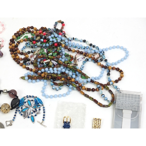 411 - Box of assorted costume jewellery including necklaces, as new wristwatches and bracelets, with a sel... 