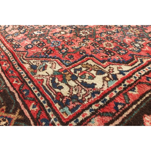 2041 - Rectangular Persian Hamadan carpet having an all over geometric floral design, 319cm x 216cm