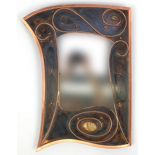 2033 - Sam Fanaroff copper mirror of stylised design with inset cabochon stone, 61cm high x 41cm wide