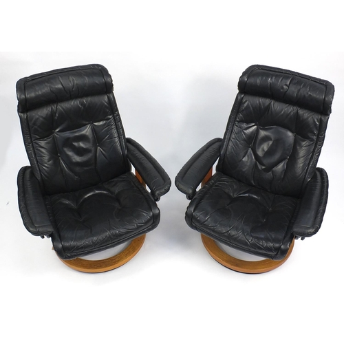 49 - Pair of black leather Stressless style armchairs
