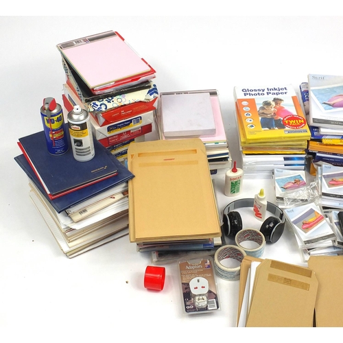 626 - Large selection of stationery including paper, photographic paper, guillotine, cello tape and pens