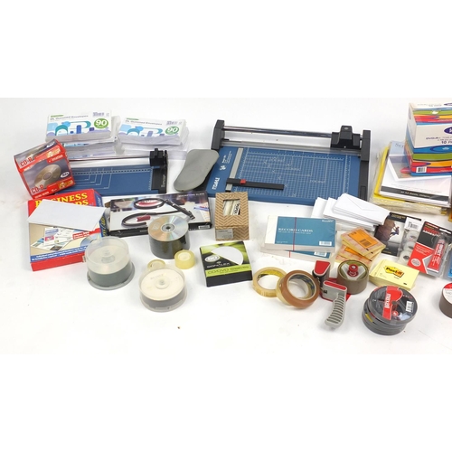 626 - Large selection of stationery including paper, photographic paper, guillotine, cello tape and pens