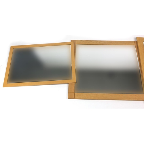 55 - Three rectangular oak mirrors, two with bevelled plates, the largest 91cm x 80cm