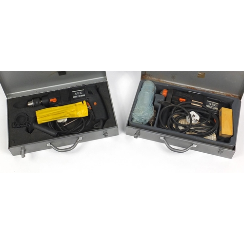 310 - Two cased AEG power drills