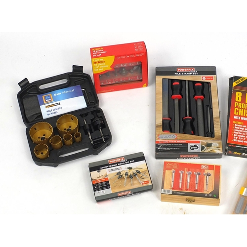 585 - Large selection of mostly router bits and two as new sets of chisels