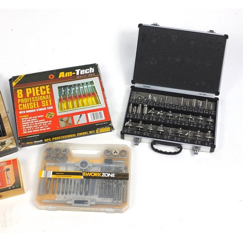 585 - Large selection of mostly router bits and two as new sets of chisels