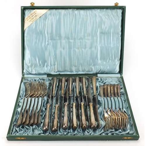 277 - Set of twelve German silver plated knives and forks, all impressed 30, housed in a fitted Mook & Shc... 