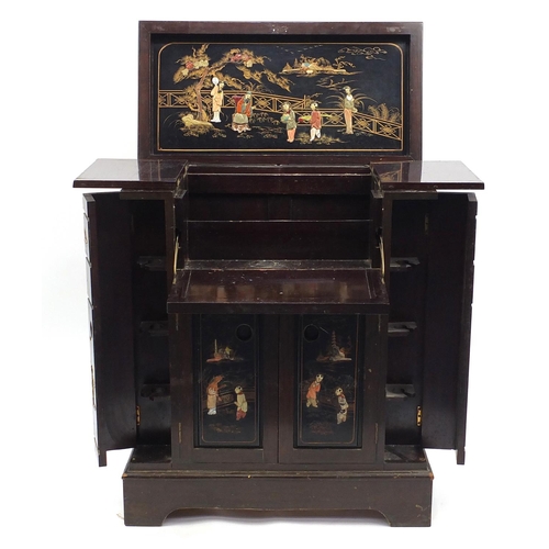 89 - Oriental hardwood and black lacquered cocktail cabinet, decorated in relief with figures, 88cm H x 7... 