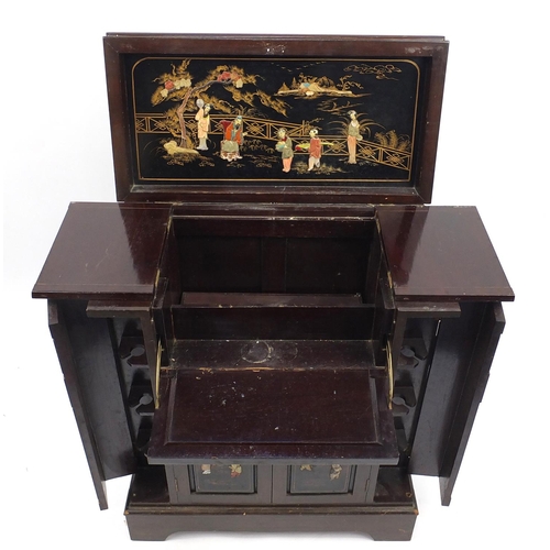 89 - Oriental hardwood and black lacquered cocktail cabinet, decorated in relief with figures, 88cm H x 7... 