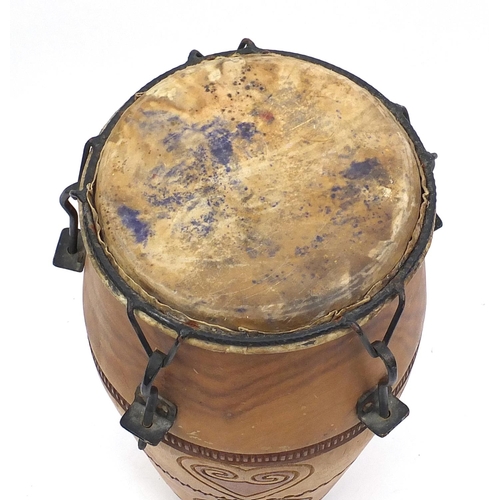 80 - African carved wood and animal skin drum, 65cm high