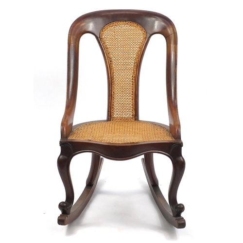 109 - Mahogany framed rocking chair with cane back and seat, 80cm high