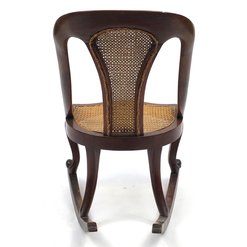 109 - Mahogany framed rocking chair with cane back and seat, 80cm high