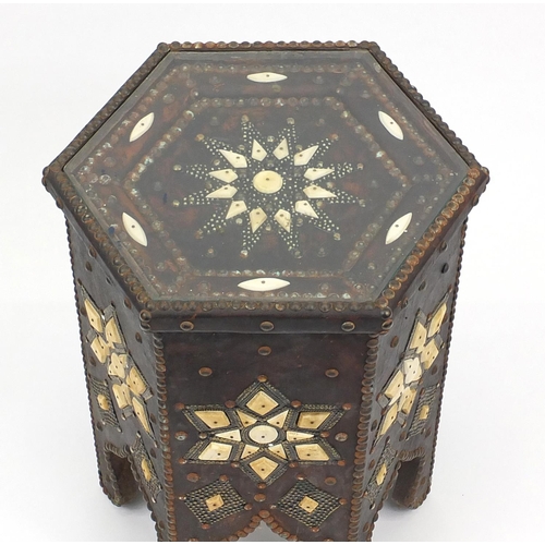 34 - Middle Eastern occasional table, relief decorated with bone panels, 53cm high