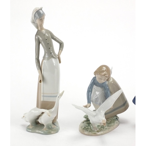 2283 - Three Lladro figurines including a girl with geese and a young girl holding a basket of flowers, the... 