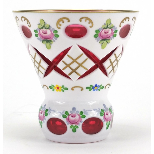 2103 - Bohemian white overlaid cranberry cut glass vase, hand painted with flowers, 12.5cm high