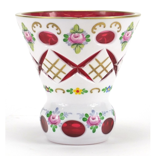 2103 - Bohemian white overlaid cranberry cut glass vase, hand painted with flowers, 12.5cm high