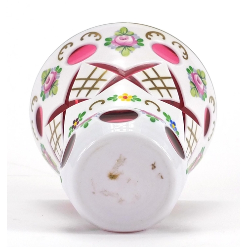 2103 - Bohemian white overlaid cranberry cut glass vase, hand painted with flowers, 12.5cm high