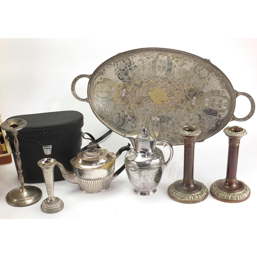 185 - Box of items including a silver plated teapot, candlesticks, cutlery and a pair of binoculars