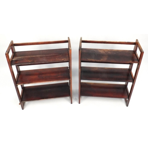 110 - Two folding wooden book shelves, stamped Made in Romania, 96cm H x 71cm W