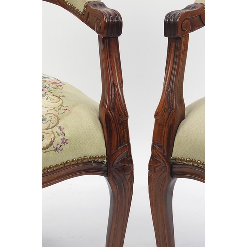 63 - Pair of French elbow chairs with needlepoint upholstered backs and seats