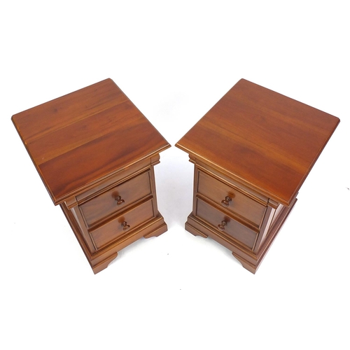 64 - Pair of American walnut two drawer bedside chests, 67cm H x 45cm W x 50cm D