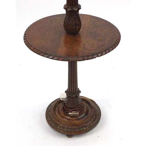 123 - Carved oak standard lamp with tea tray, 152cm high