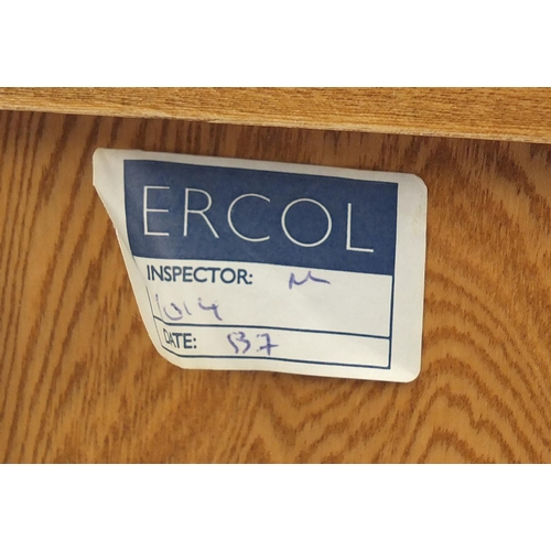 2008 - Ercol light elm side cabinet fitted with two drawers above a pair of cupboard doors, enclosing an ad... 