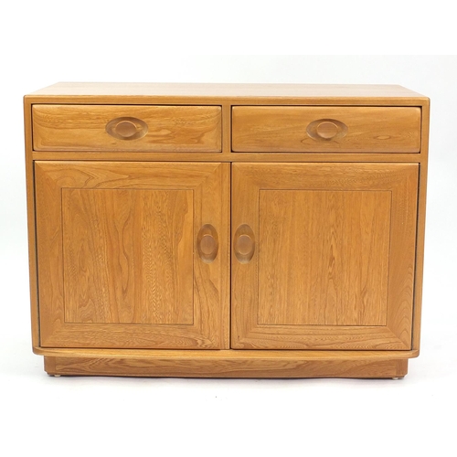 2007 - Ercol light elm side cabinet fitted with two drawers above a pair of cupboard doors, 69cm H x 92cm W... 