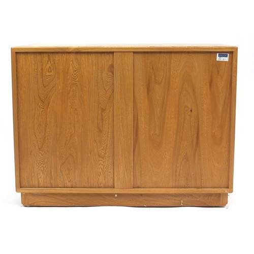 2007 - Ercol light elm side cabinet fitted with two drawers above a pair of cupboard doors, 69cm H x 92cm W... 