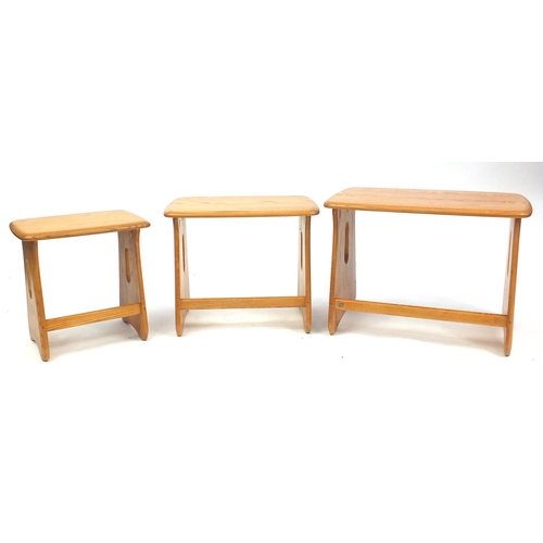 2027 - Ercol light elm nest of three occasional tables, the largest 45cm H x 62.5cm W x 40.5cm D