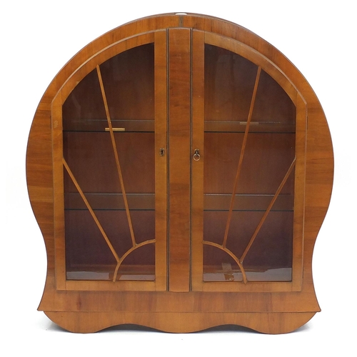 2001 - Art Deco walnut display cabinet fitted with a pair of sunburst glazed doors enclosing two glass shel... 