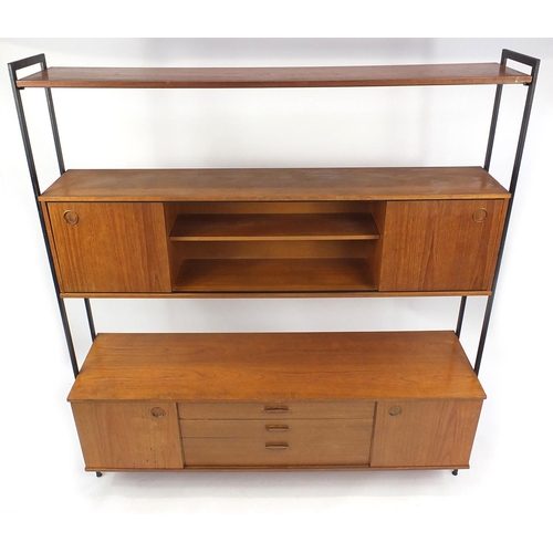2019 - Vintage teak Avalon room divide fitted with an arrangement of sliding doors and drawers, 181cm H x 1... 