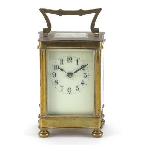 2134 - Brass cased carriage clock with bevelled glass sides and enamelled dial, 12cm high