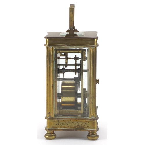 2134 - Brass cased carriage clock with bevelled glass sides and enamelled dial, 12cm high