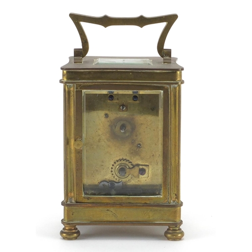 2134 - Brass cased carriage clock with bevelled glass sides and enamelled dial, 12cm high